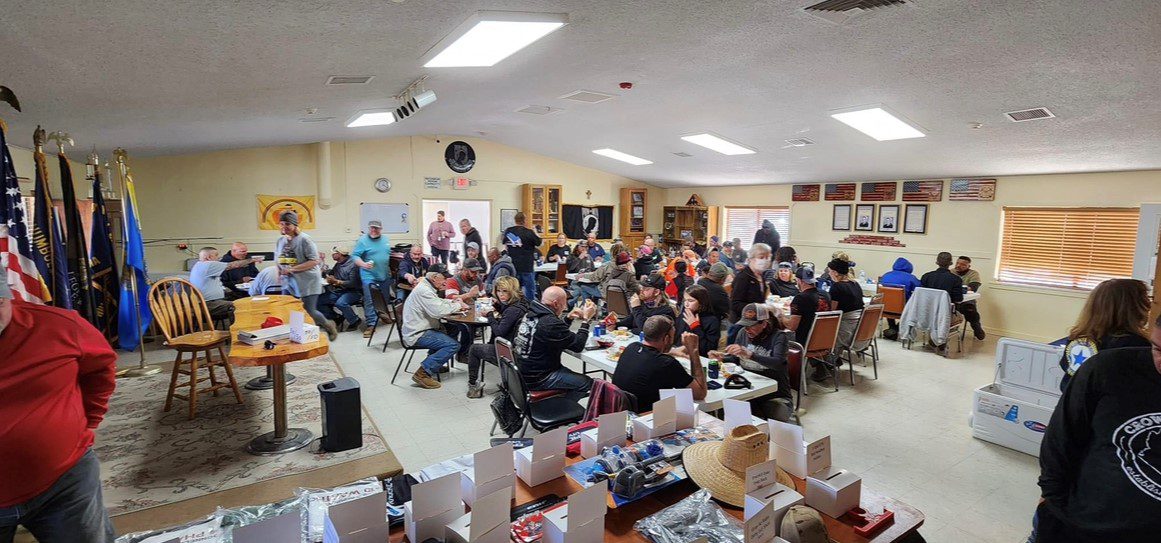 A large group of people sitting at tables.