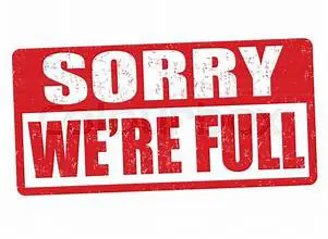 A red and white sign that says sorry we 're full.