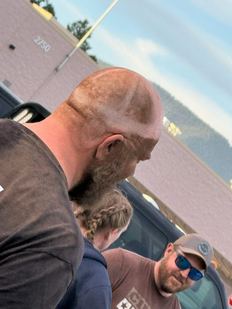 Group of men talking in parking lot