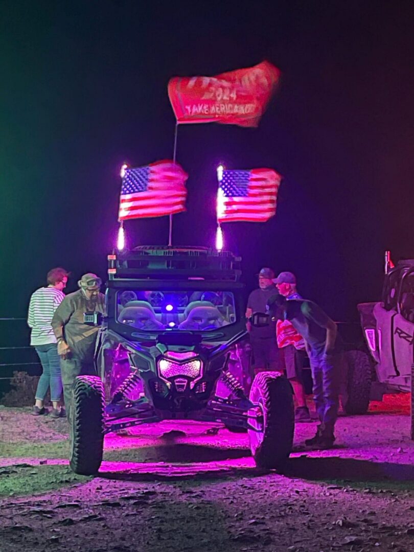 Illuminated off-road UTV with American flags