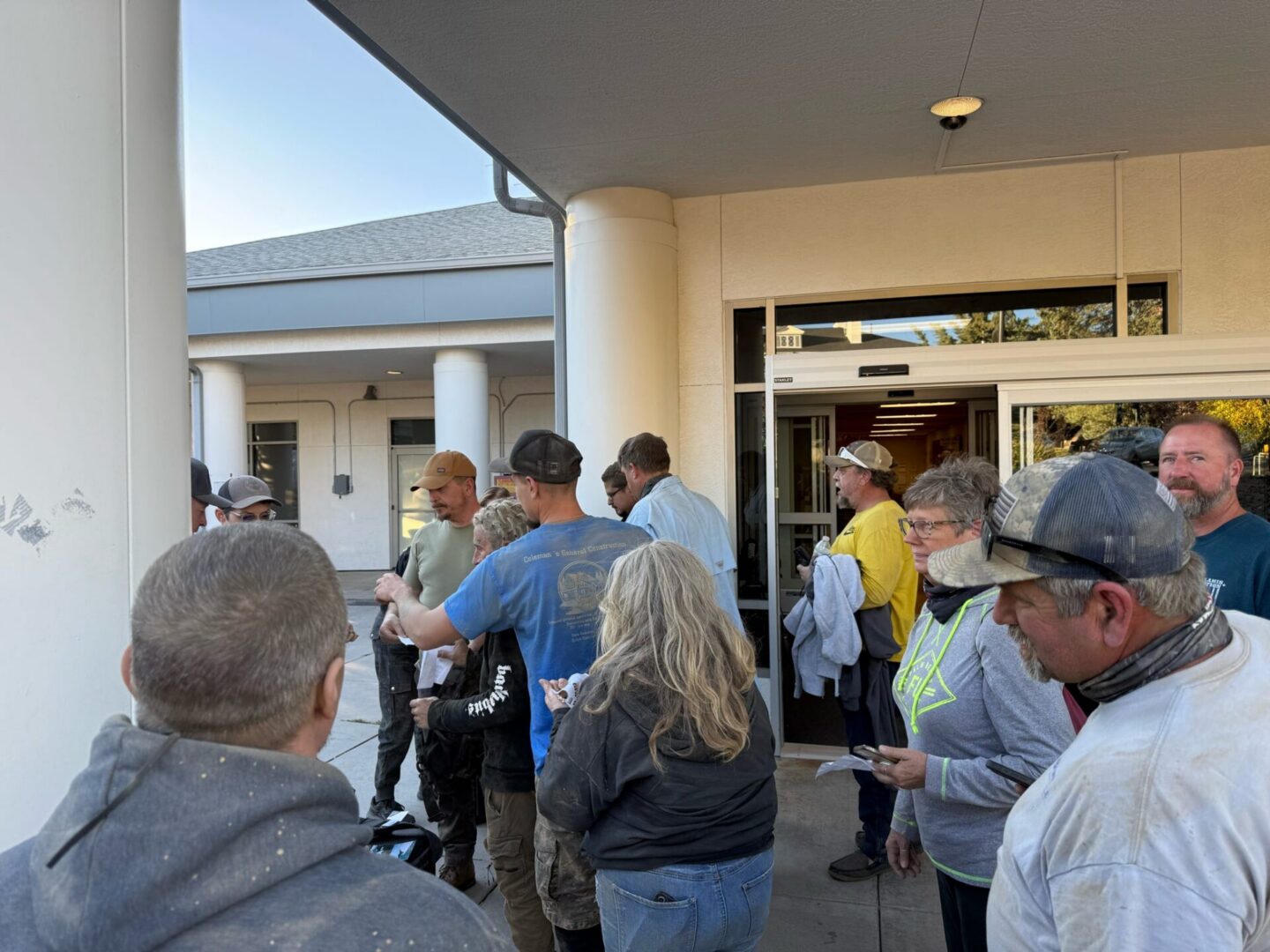 People lined up outside building entrance