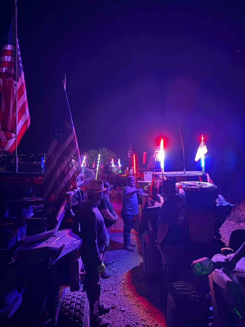 Nighttime off-road vehicles with American flags