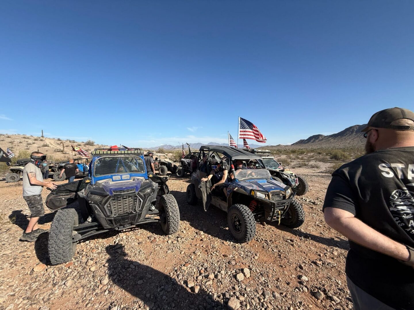 Off-road UTVs with American flags in desert