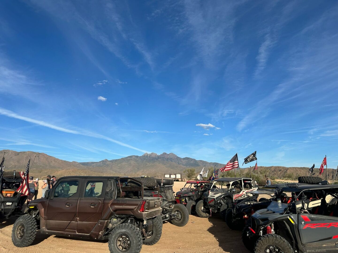 Group of off-road UTVs with American flags