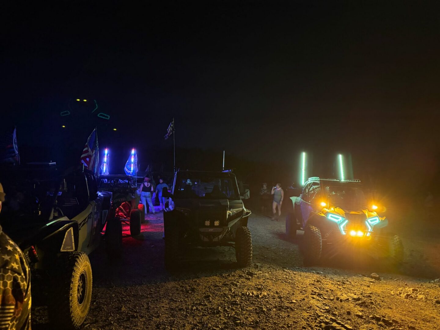 UTVs parked at night with LED lights