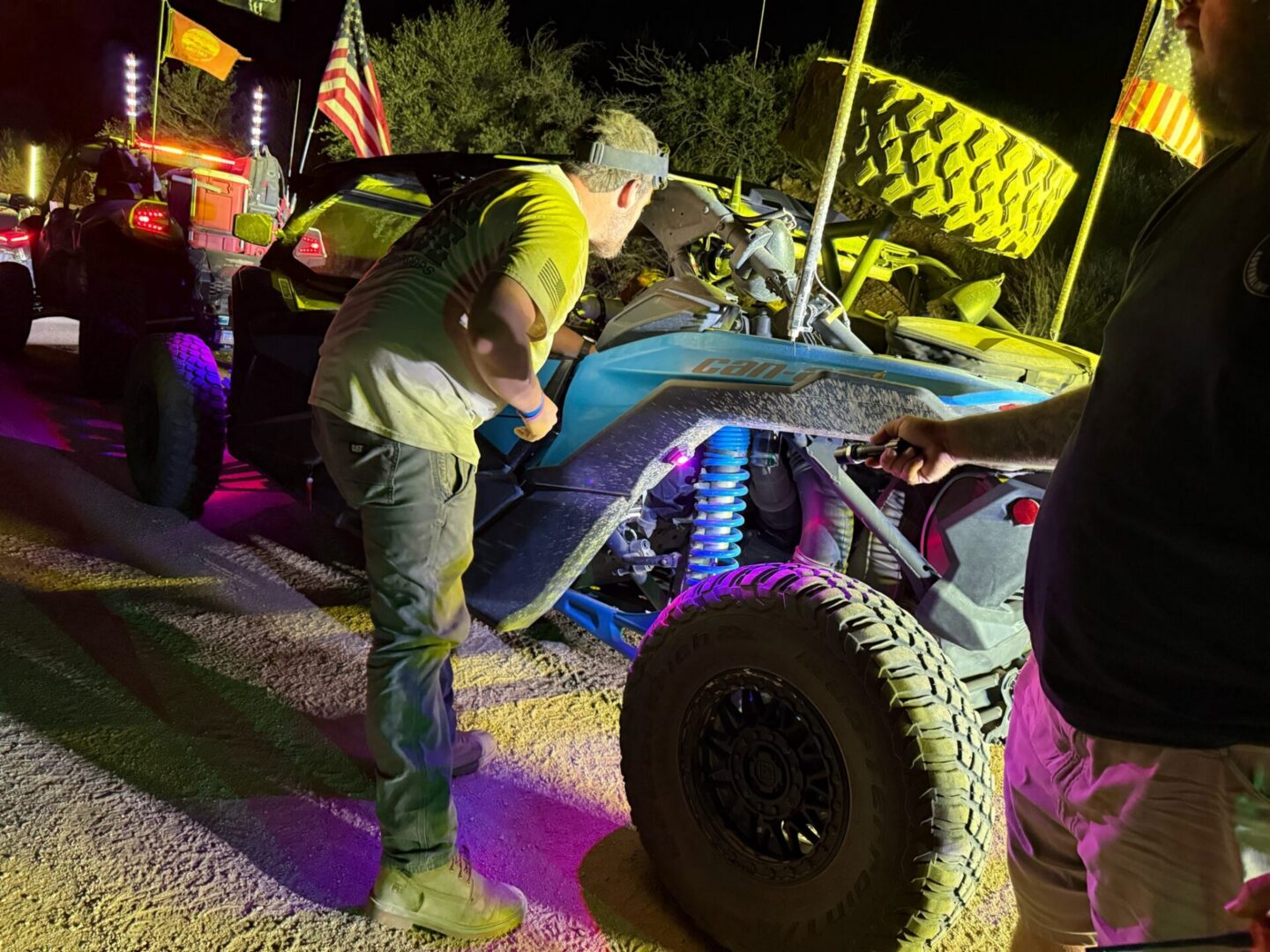 Off-road vehicle inspection under colorful lights