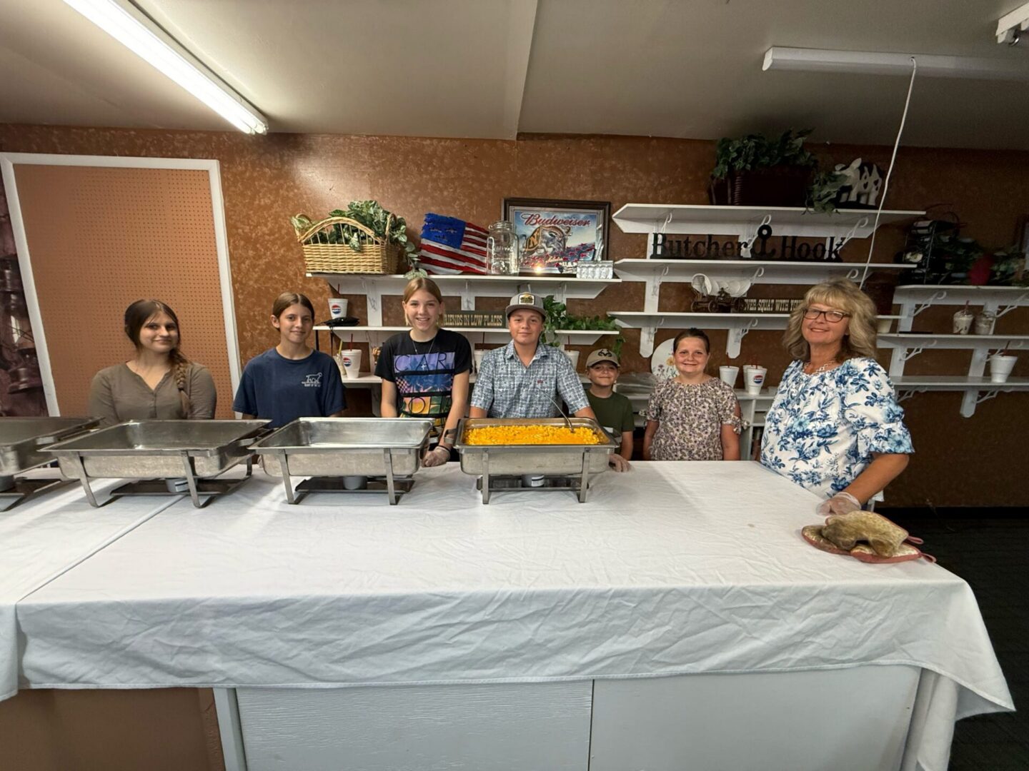 Community volunteers serving food at buffet