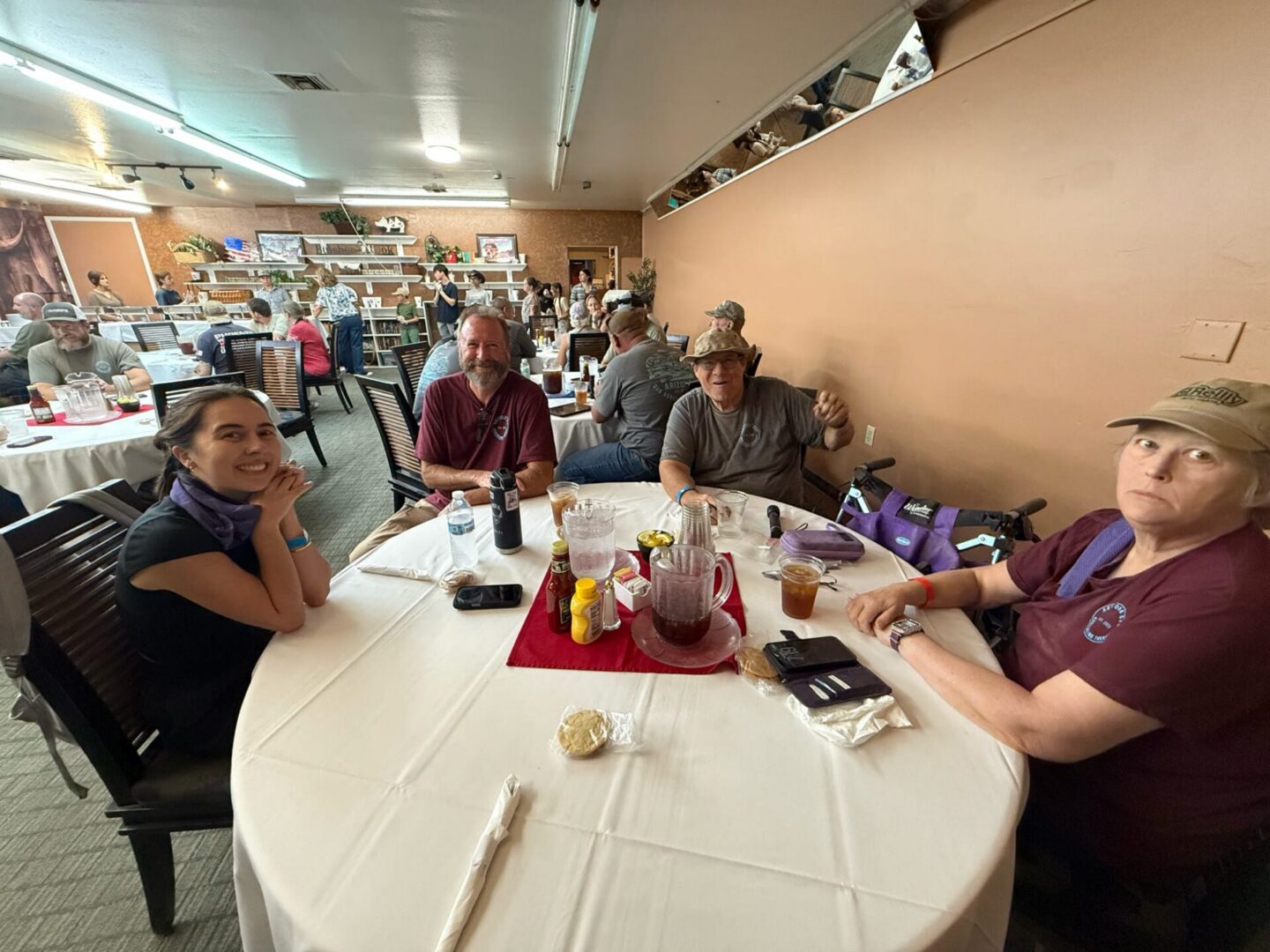 Group of people dining at round restaurant table