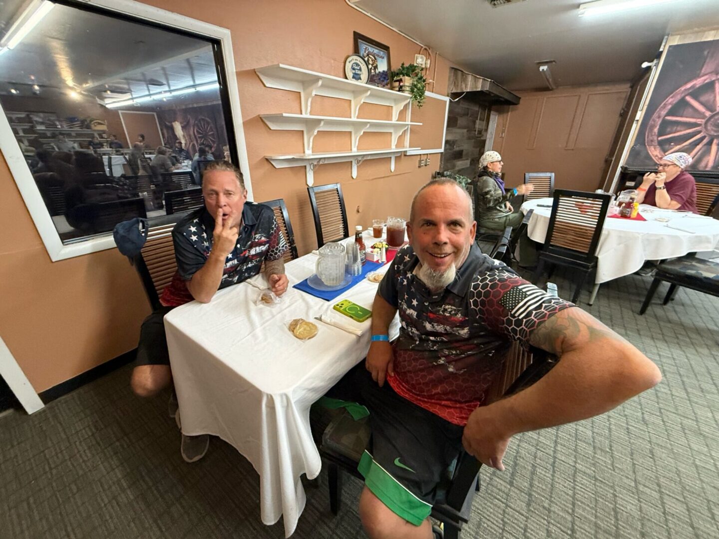 Two men sitting at a restaurant table