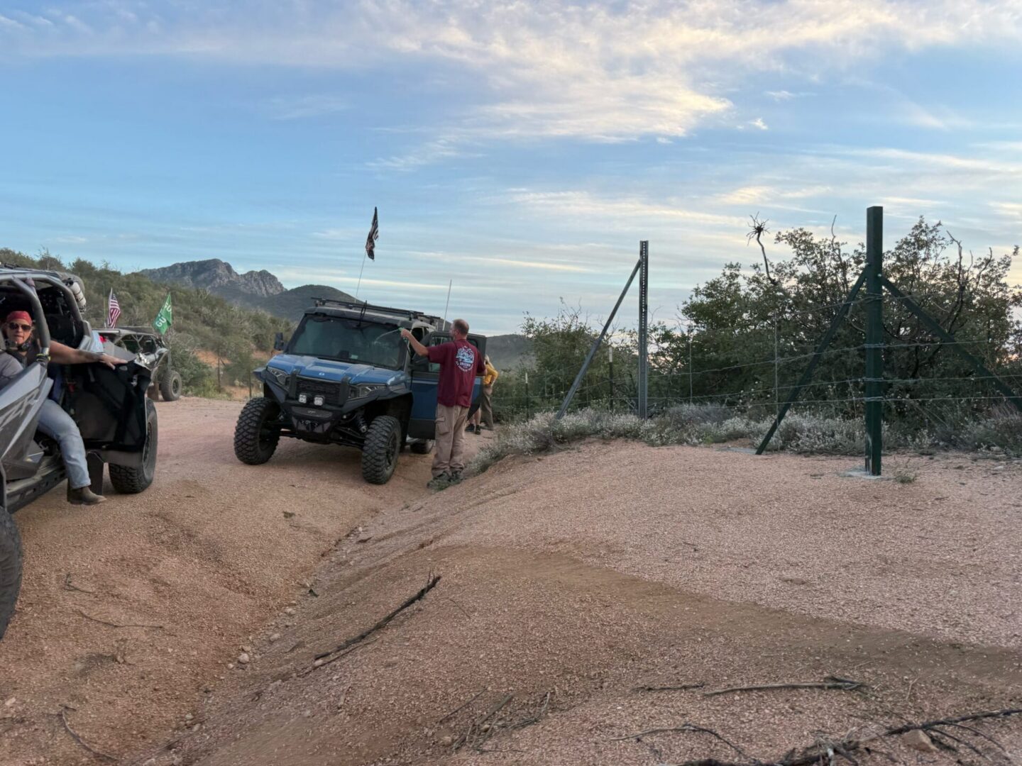UTVs stopped on sandy desert trail