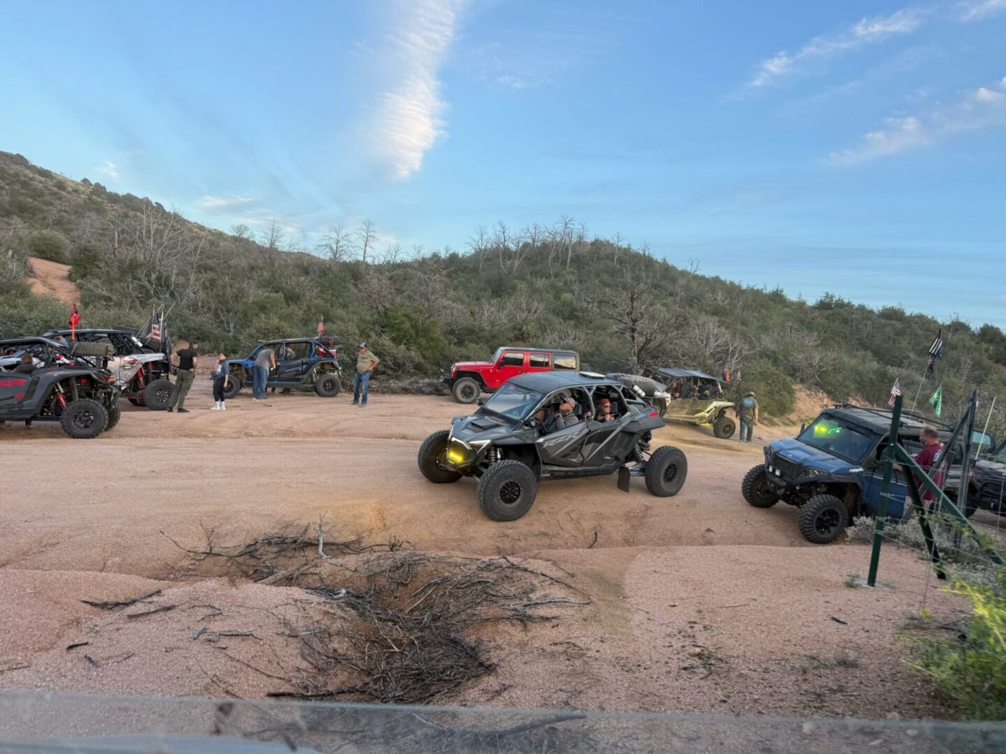 Group of off-road UTVs on dirt trail
