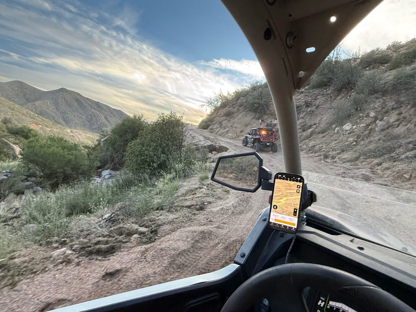 Off-road UTV dashboard view on rugged trail