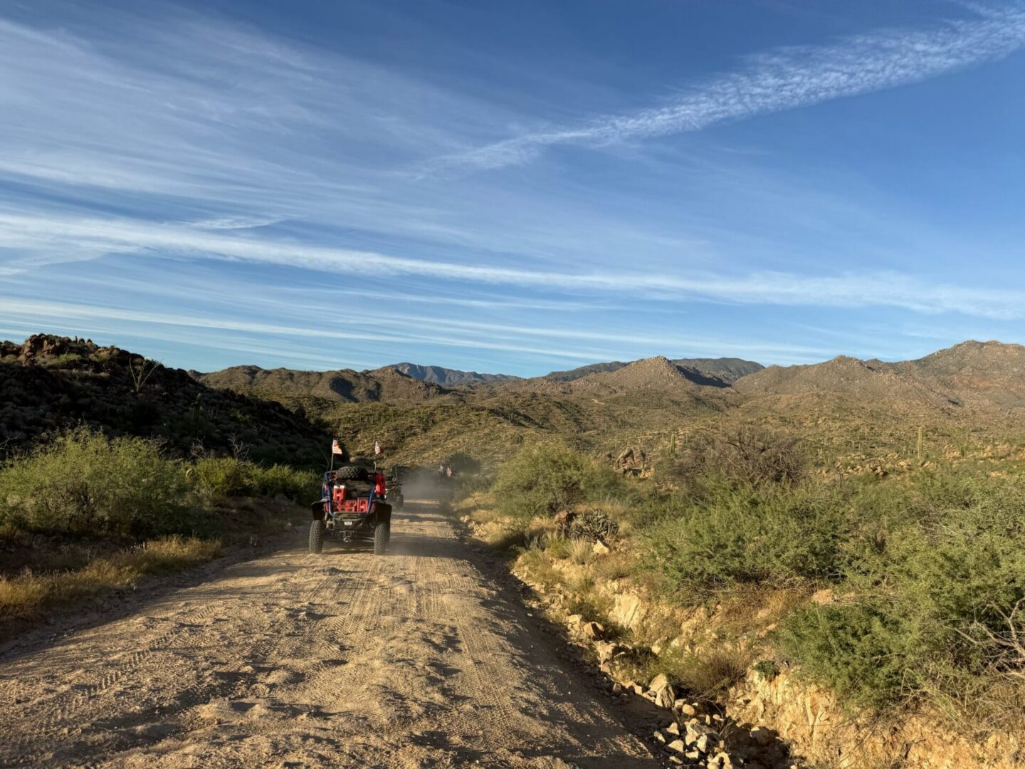 Off-road ATV driving on desert dirt road