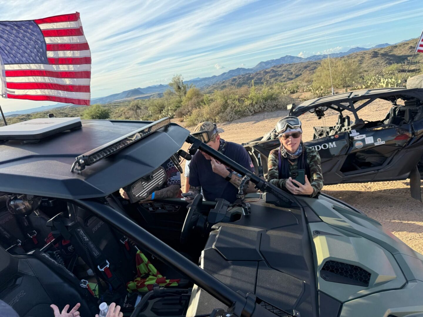Off-road UTVs with American flags in desert