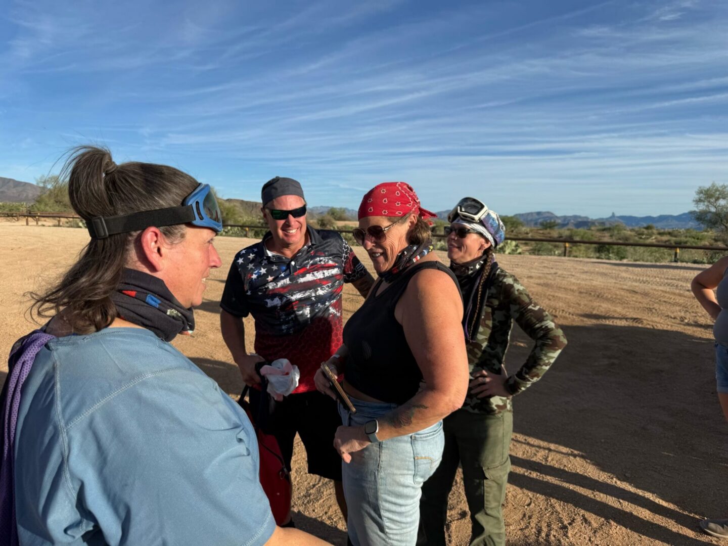 Group of cyclists chatting in desert