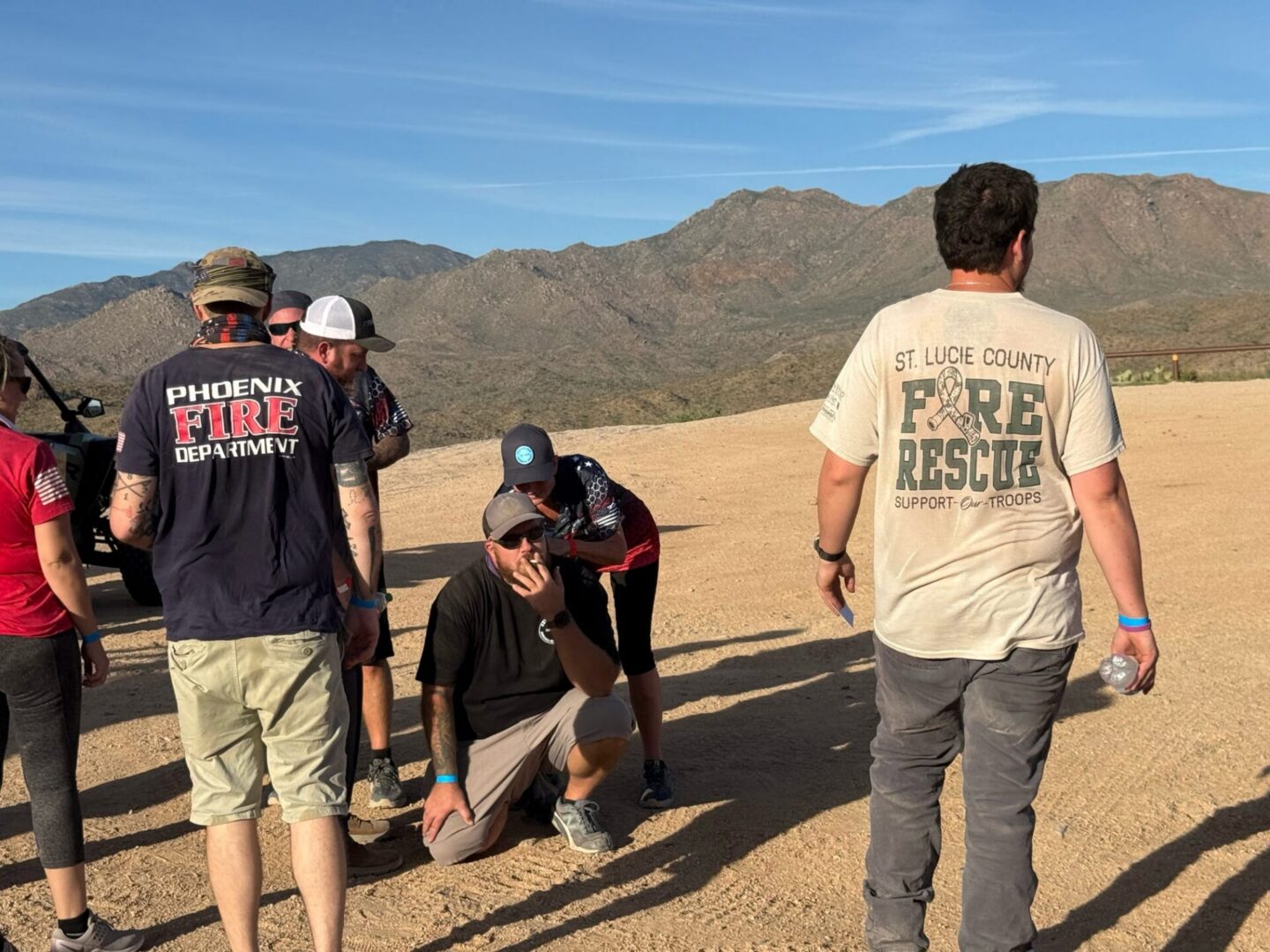 Group of firefighters and volunteers in desert
