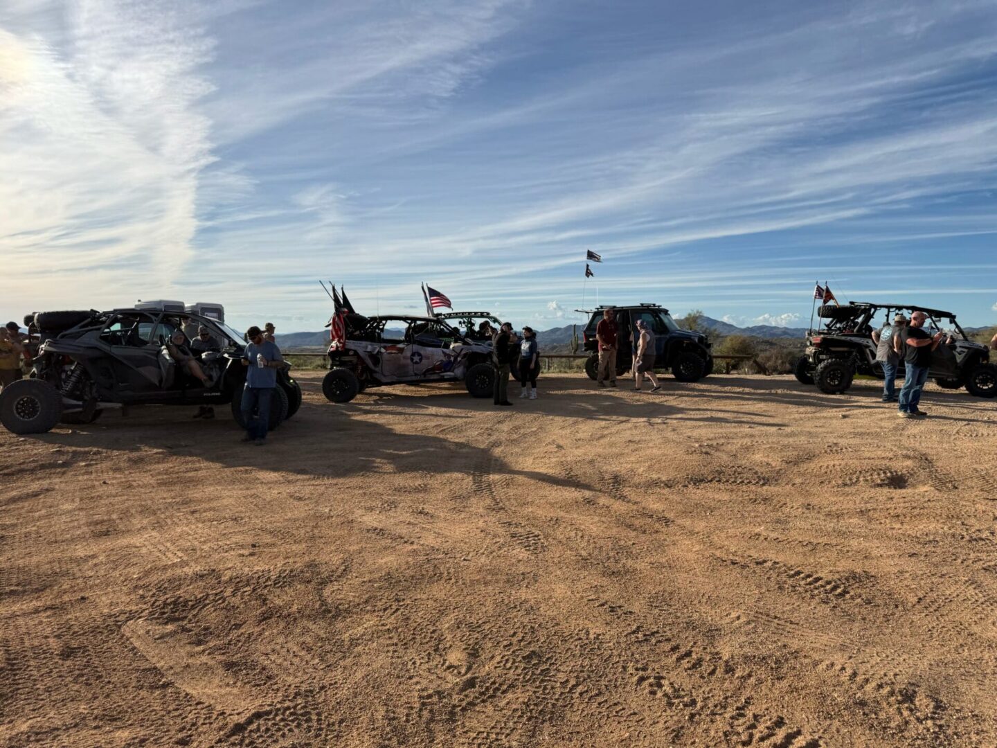 Off-road UTVs with flags on desert plateau