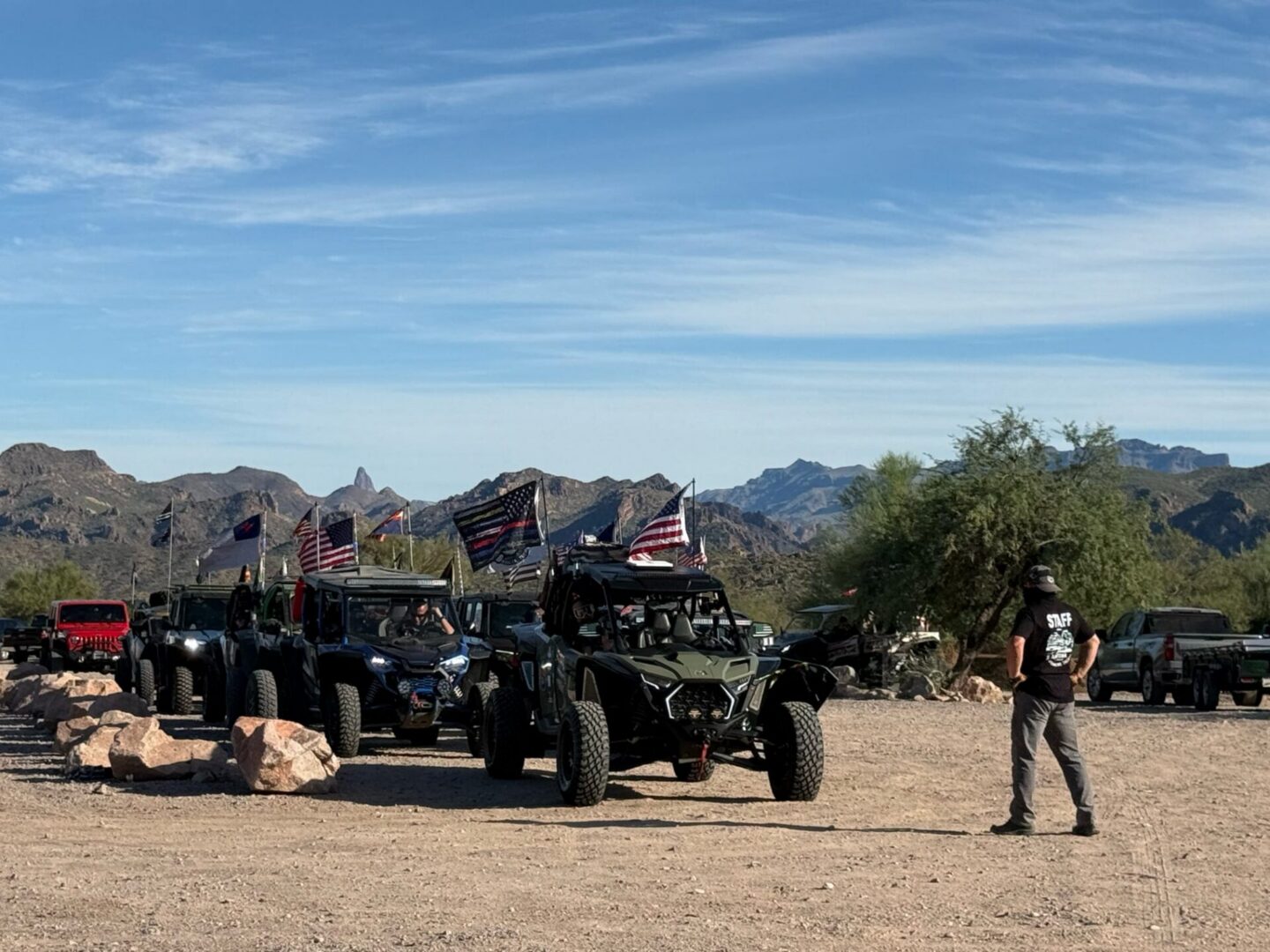 Off-road vehicles with American flags in desert