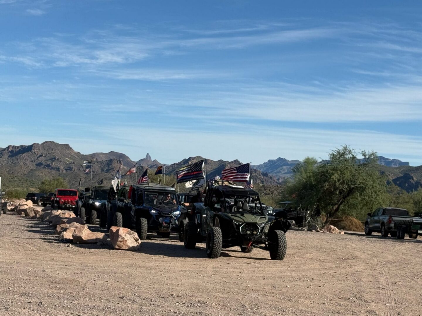 Off-road vehicles with American flags in desert