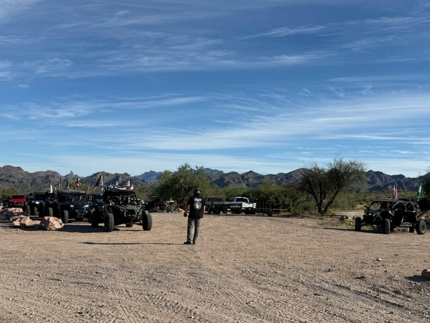 Group of off-road vehicles parked in desert