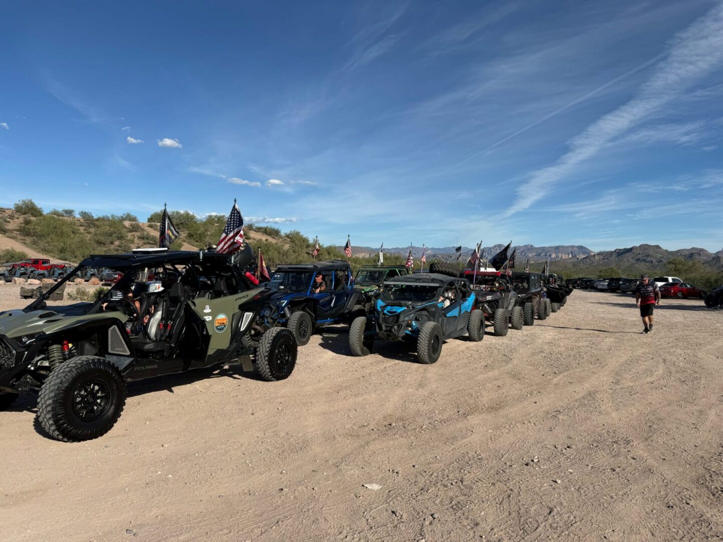 Row of off-road UTVs with American flags