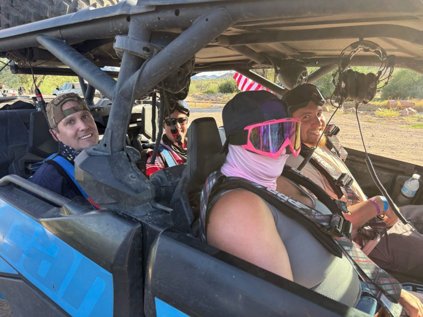 Four people riding in off-road UTV