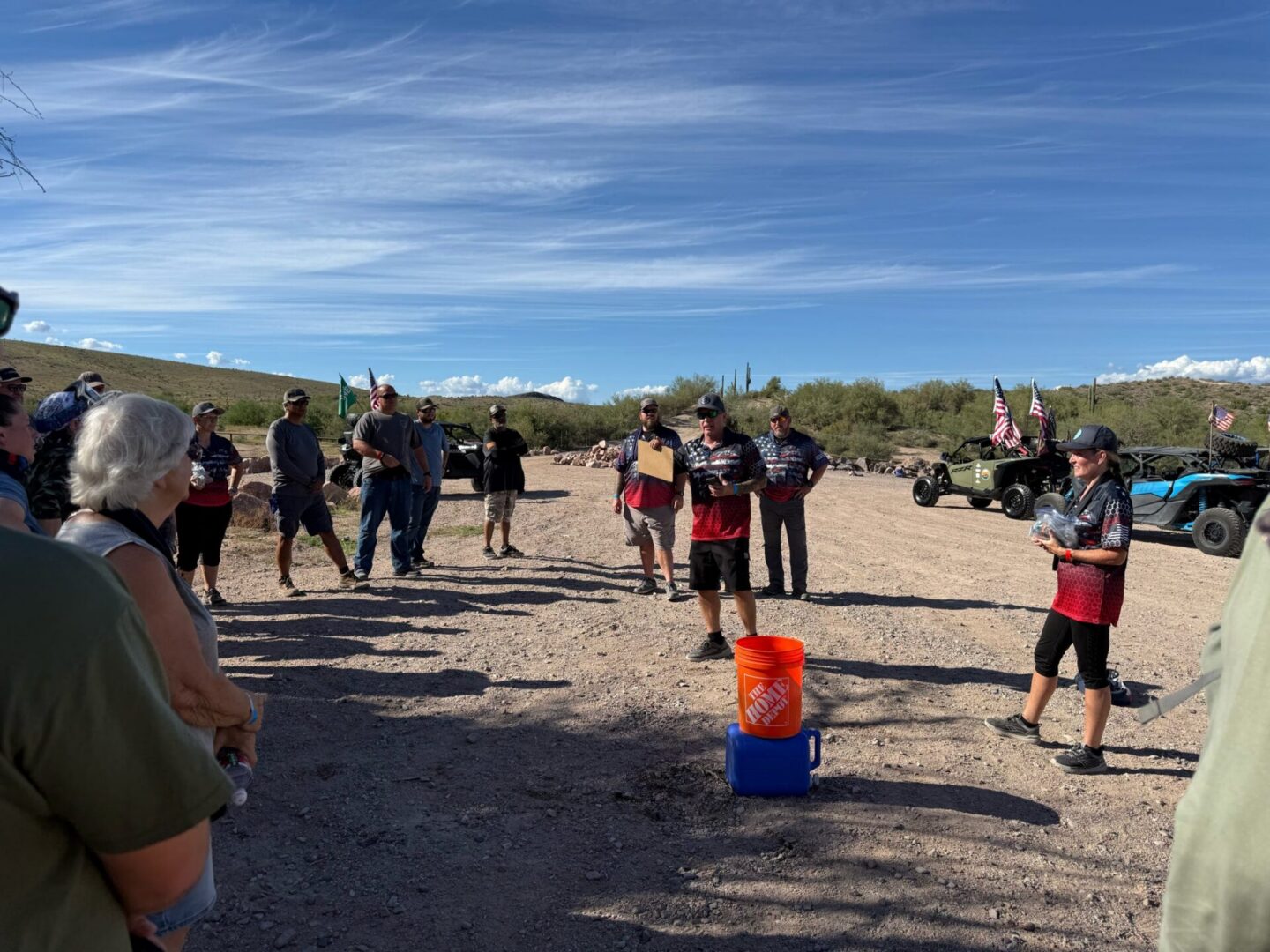Group of off-road enthusiasts meeting in desert