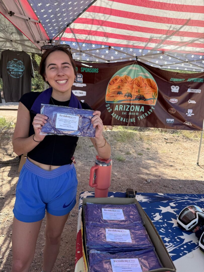 Woman holding packaged product at Arizona booth
