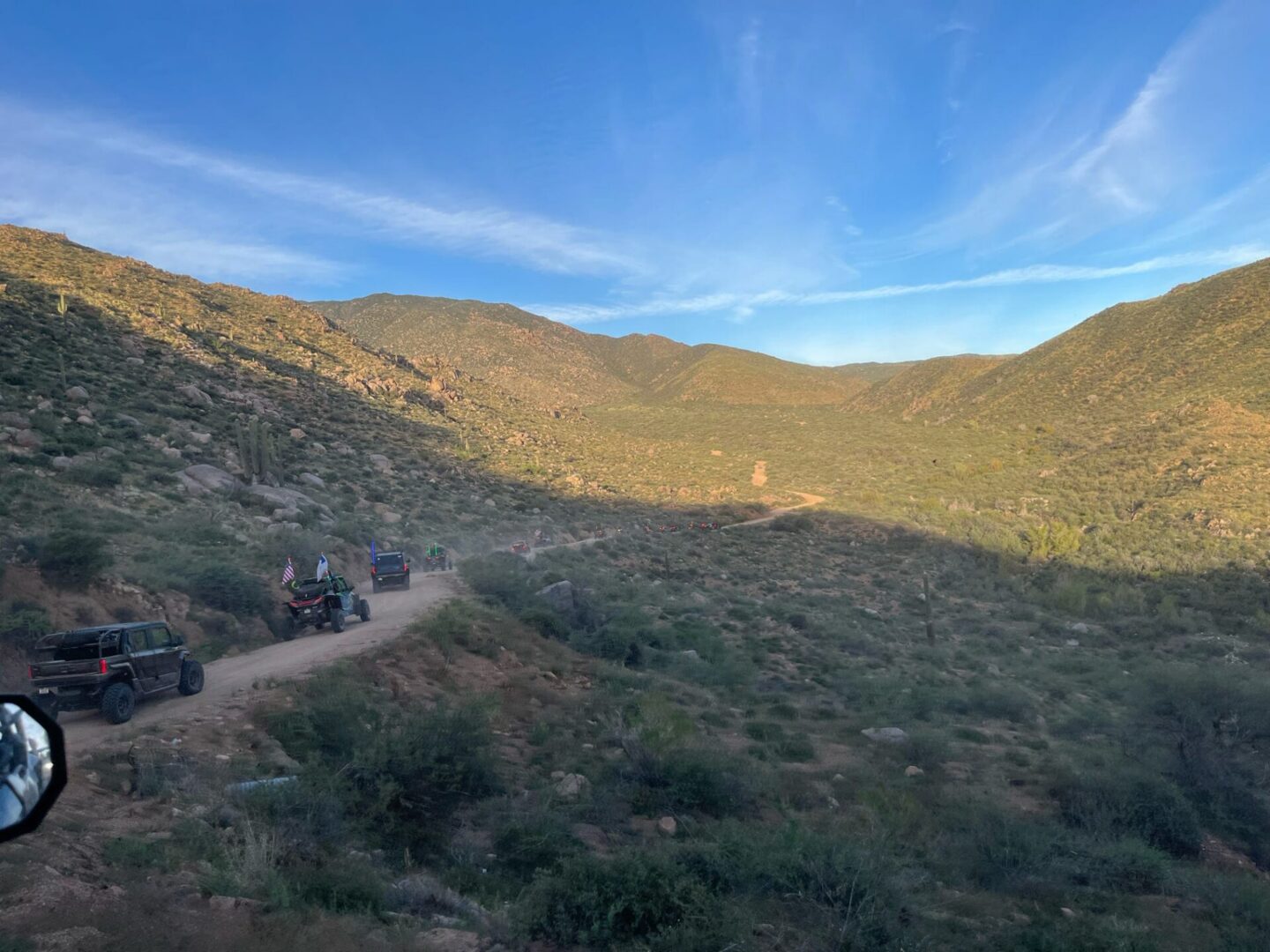 Off-road vehicles driving on desert mountain trail