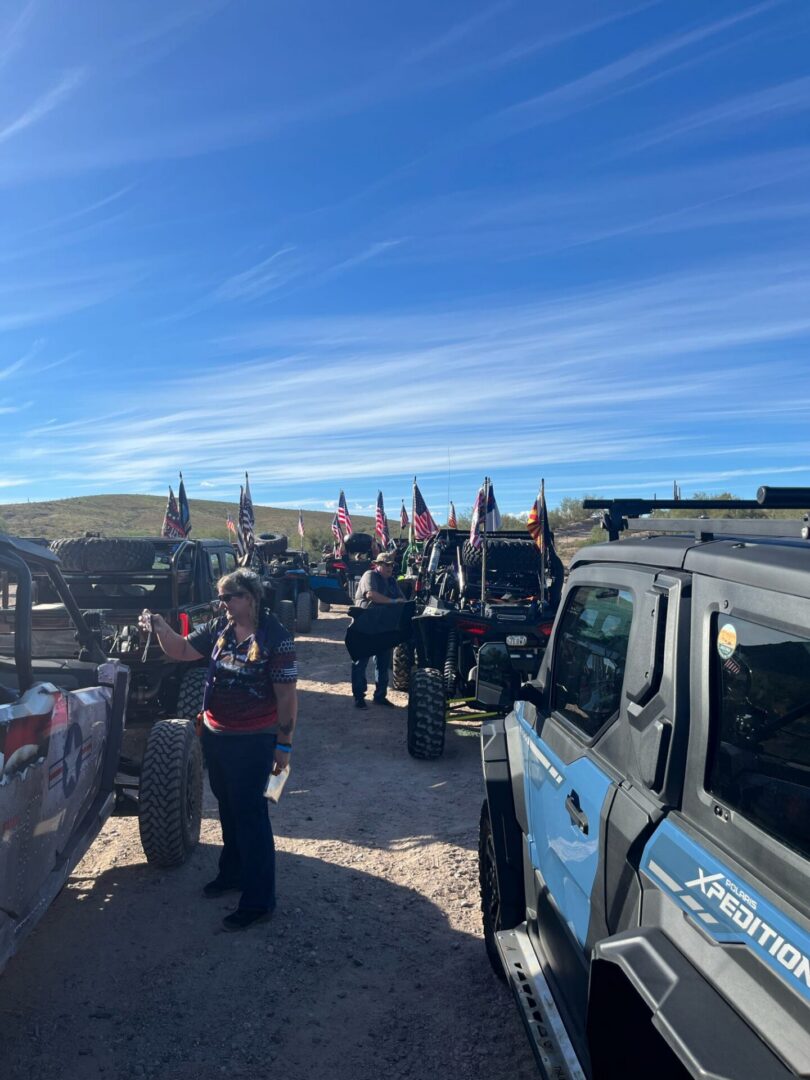 Off-road vehicles lined up with American flags