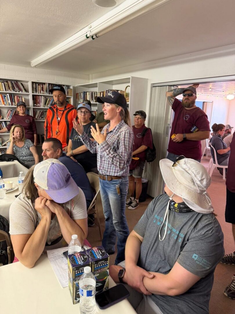 People meeting in room, woman speaking