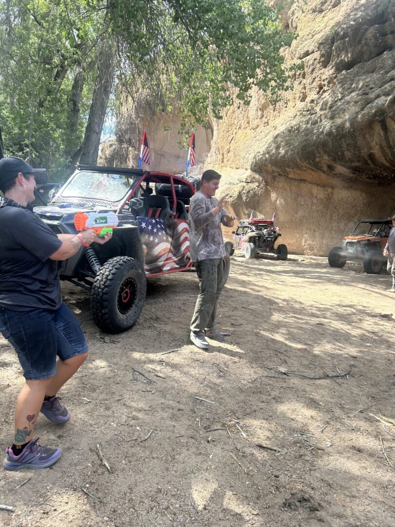 American flag off-road vehicle with people outdoors