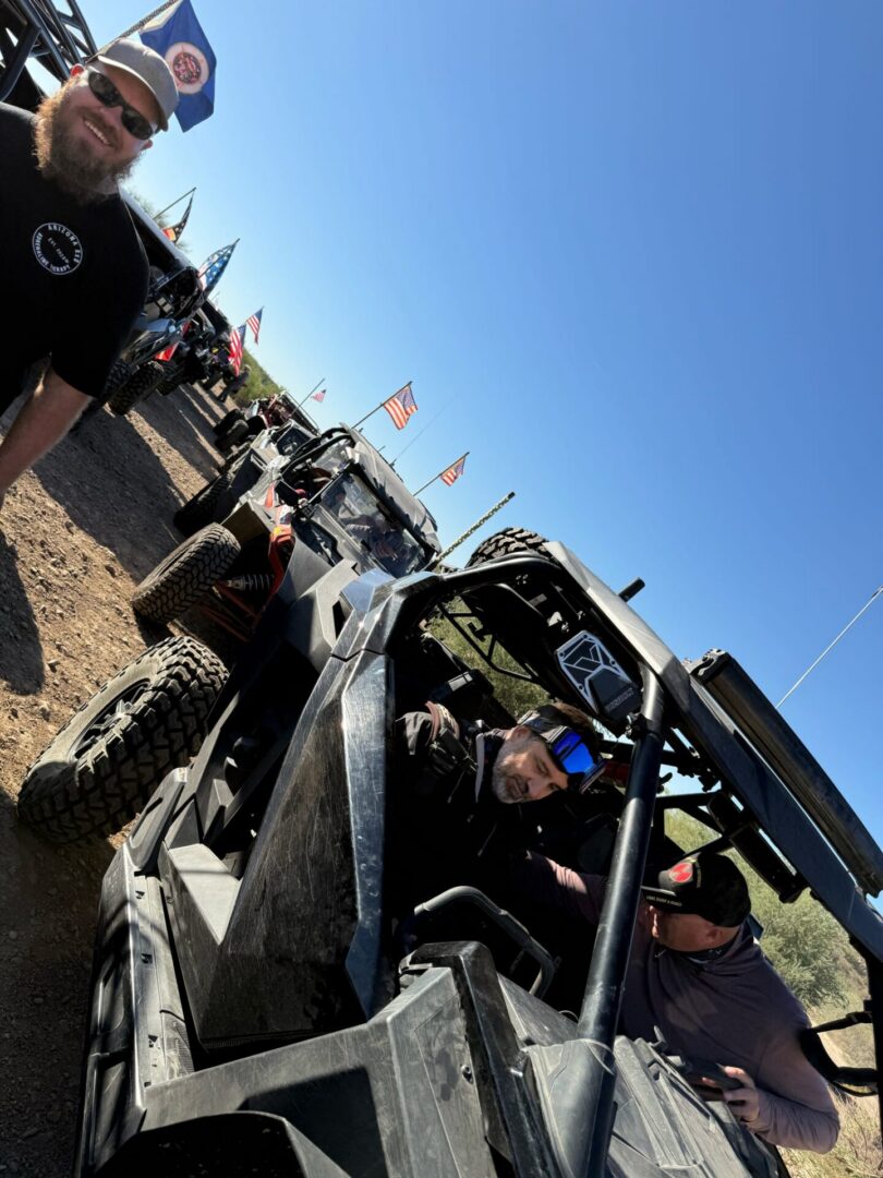 Row of off-road UTVs with American flags