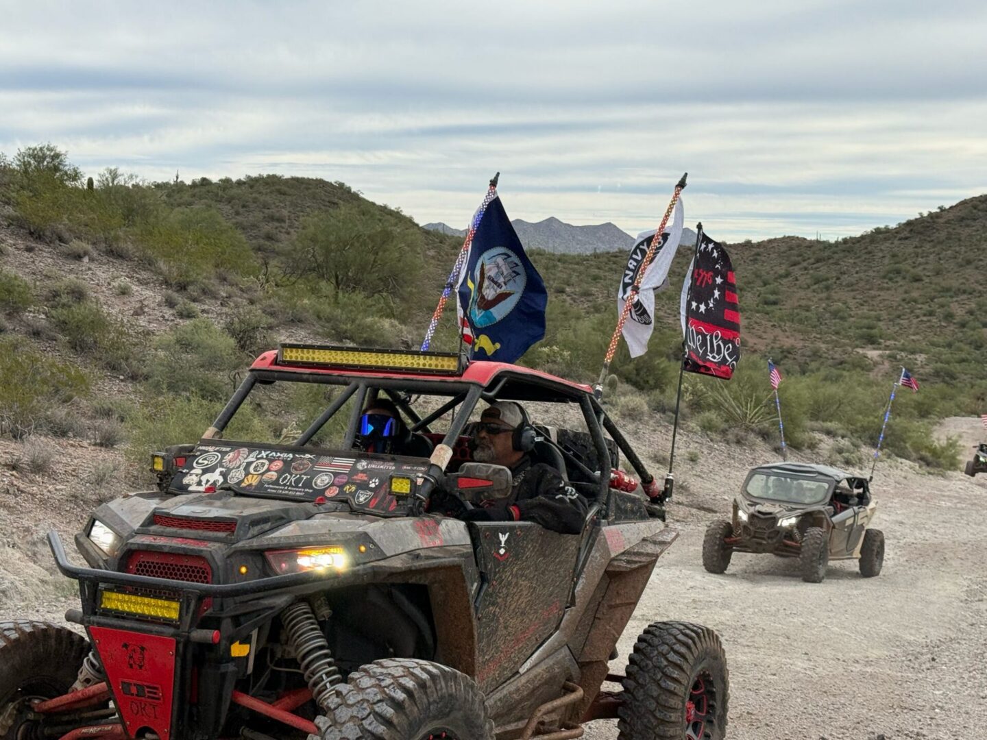 Two off-road UTVs on desert trail