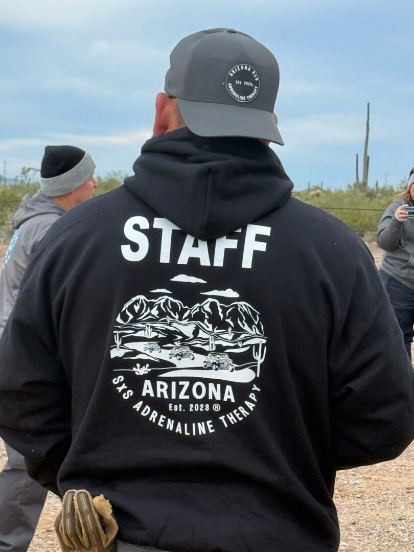 Person wearing "STAFF" Arizona hoodie