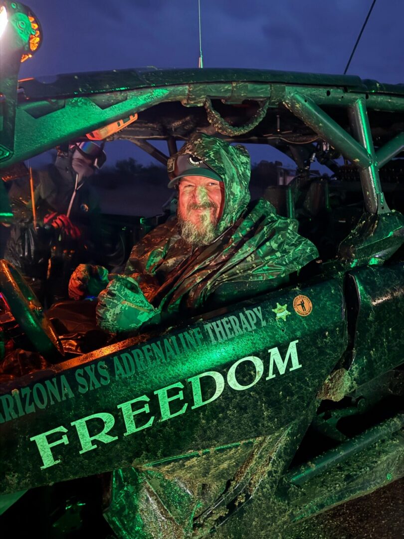 Smiling person in FREEDOM off-road vehicle