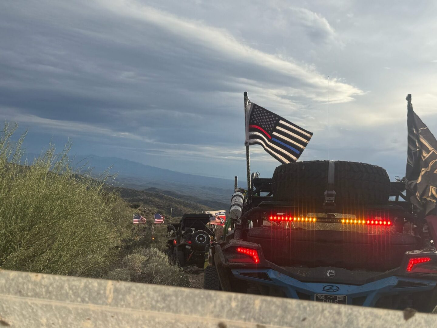 Off-road convoy with thin blue line American flag