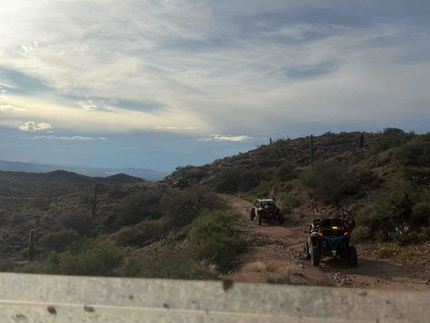 Two off-road vehicles on desert trail