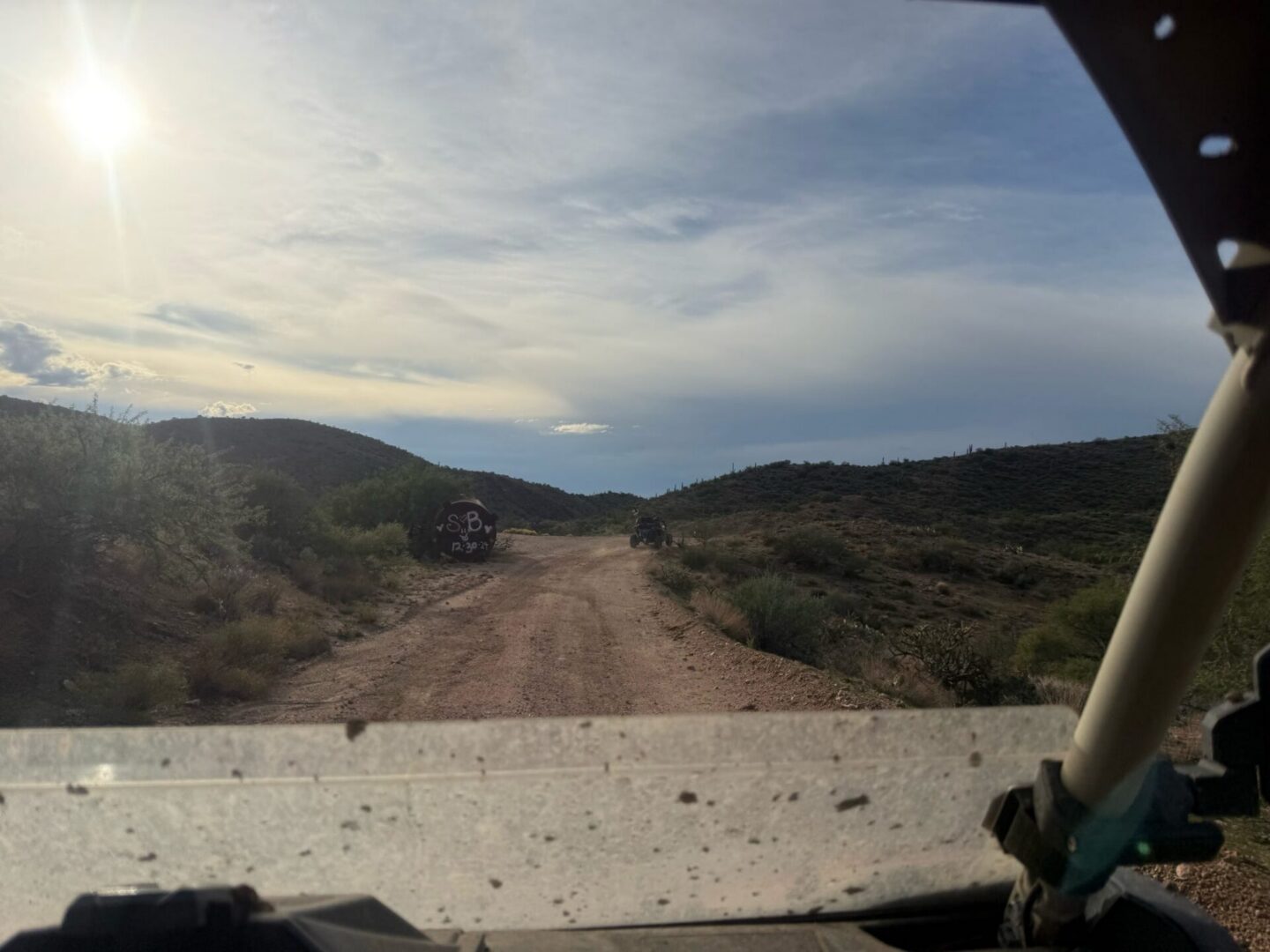 View from off-road vehicle on dirt road