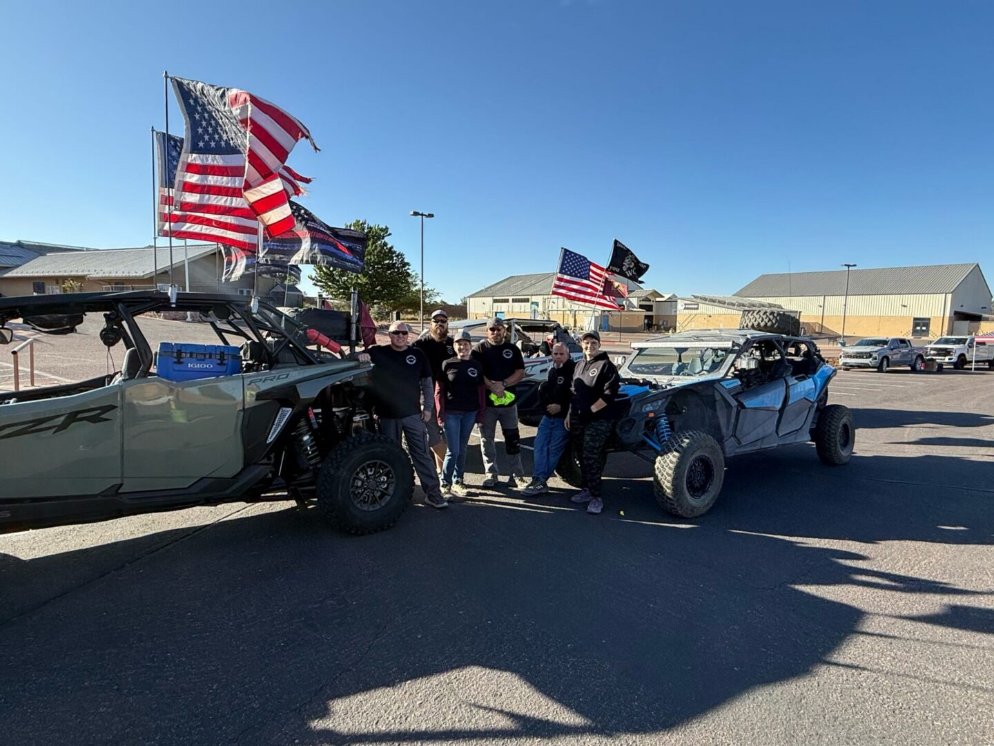 People with off-road vehicles and American flags