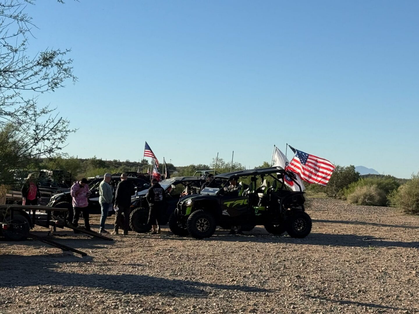 Off-road UTVs with American flags in desert