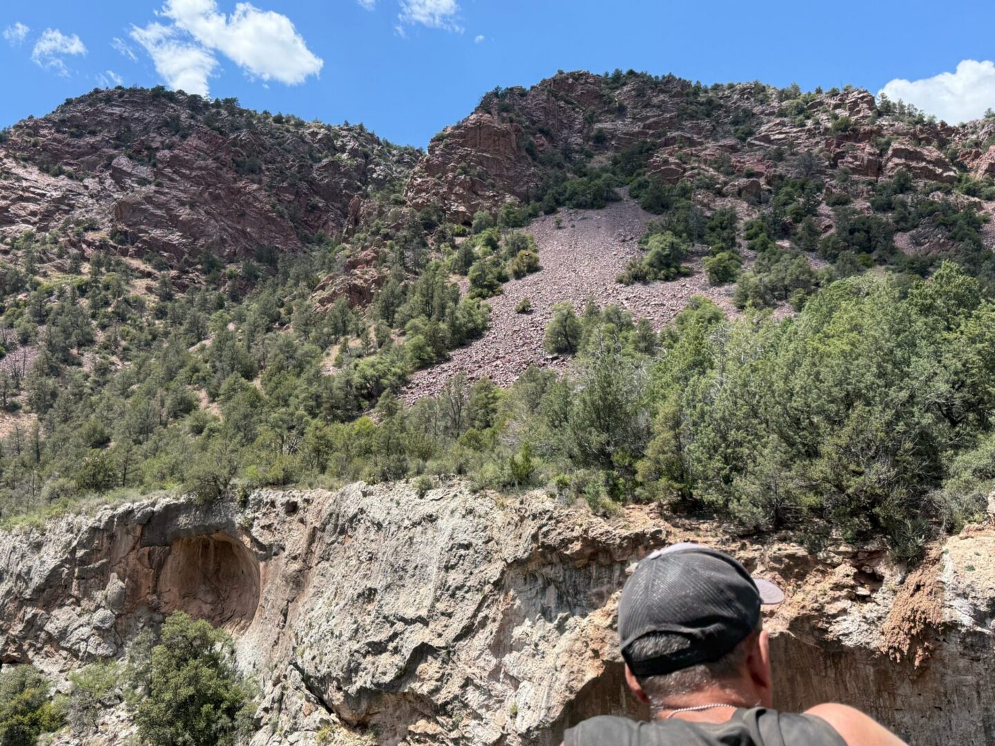 Person viewing red rock mountain landscape